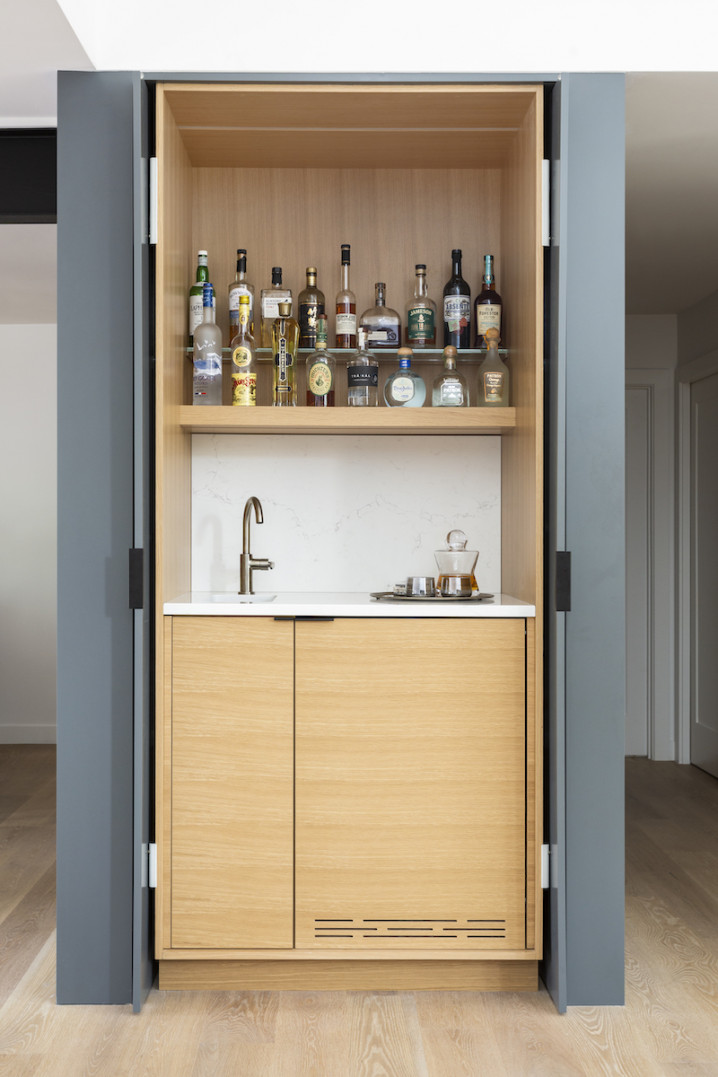 home-bar-behind-doors-design-drink-bottles-shelving